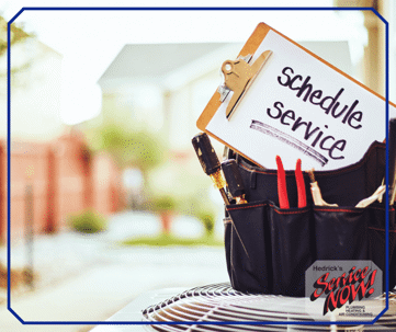 Picture of a clip board in a tool bag with the words "Schedule Service" written on it