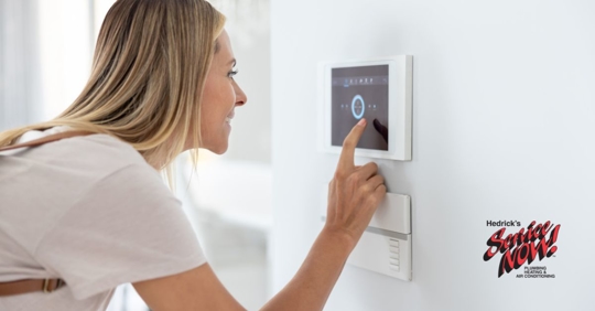 Adjusting thermostat.