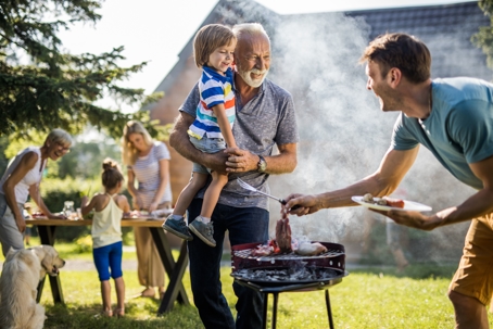 Family enjoying a barbecue outdoors