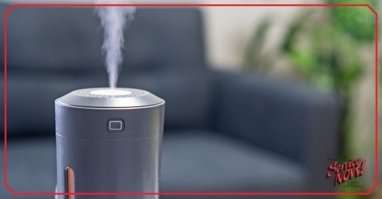 humidifier emitting steam with couch in background